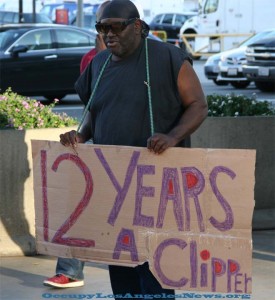 "12 Years A Clipper" guy carried his sign during a protest outside Staple Center. "12 Years A Clipper" guy carried his sign during a protest outside Staple Center.